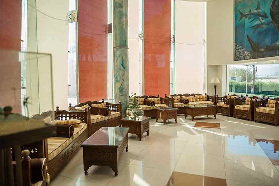 Lobby seating area with tall windows