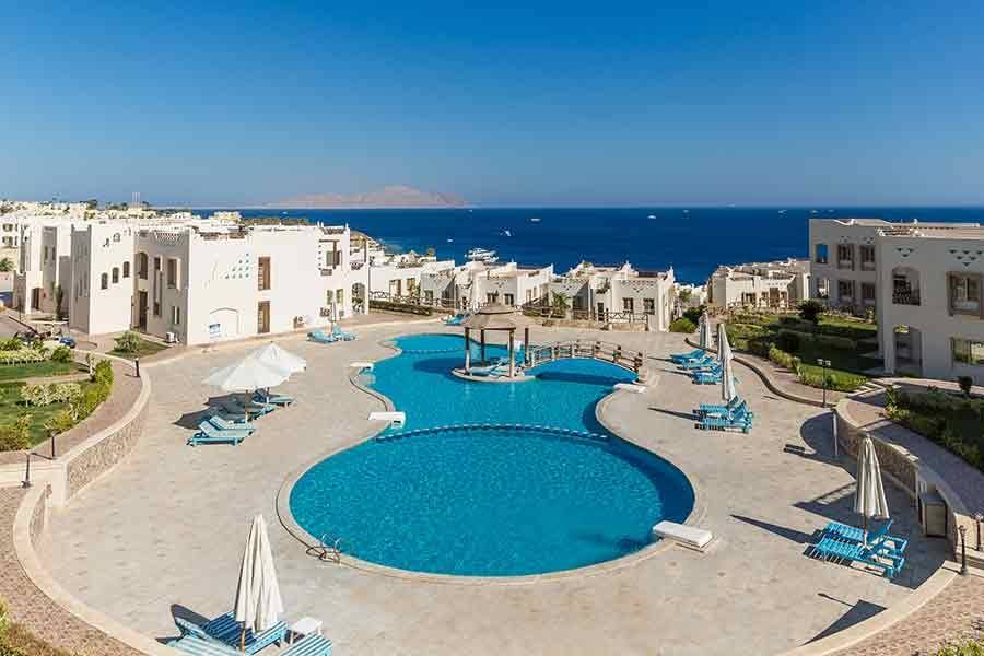 Round pool with the sea and Shark’s Bay coastline behind