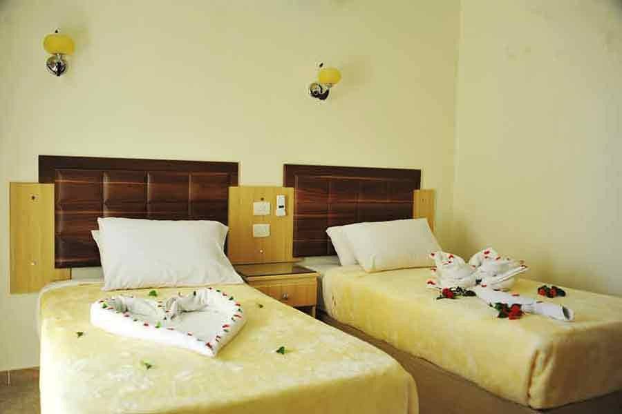 Twin bedroom with wooden headboards